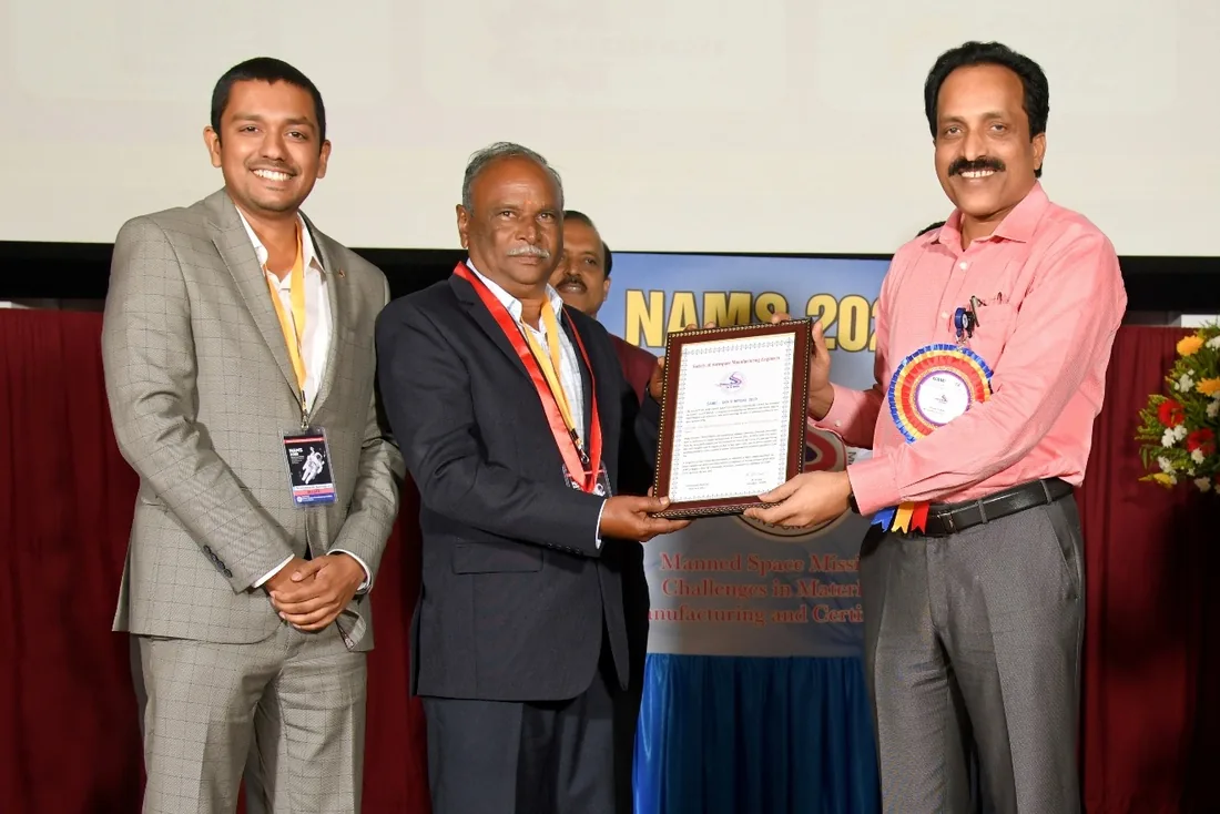 Mr. S. Periyasamy receiving an award at NAMS